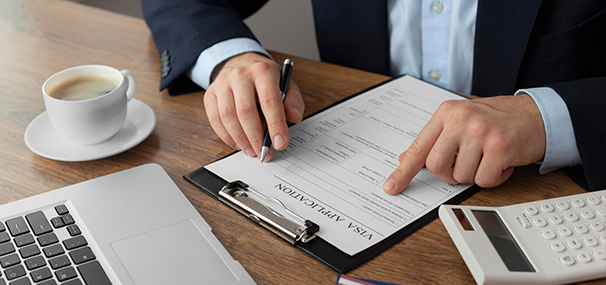 Person filling visa application form for Abroad Study Consultancy Kerala